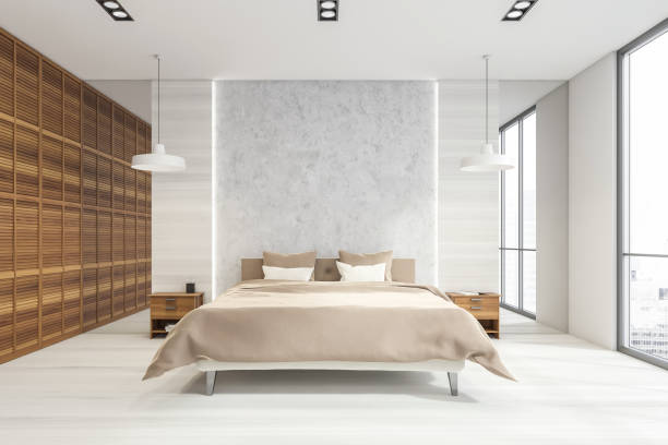 istock Wood and grey stone bedroom with beige bed 1342807778