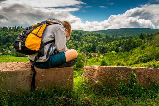 istock teenager take a break during hiking tour 1342808003
