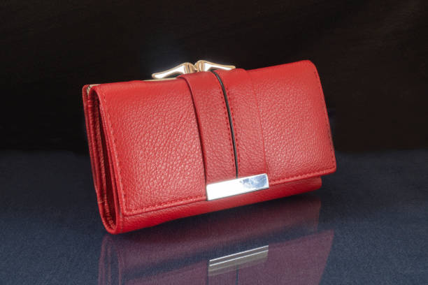 istock The red wallet is lying on the table with the reflection. 1342810616