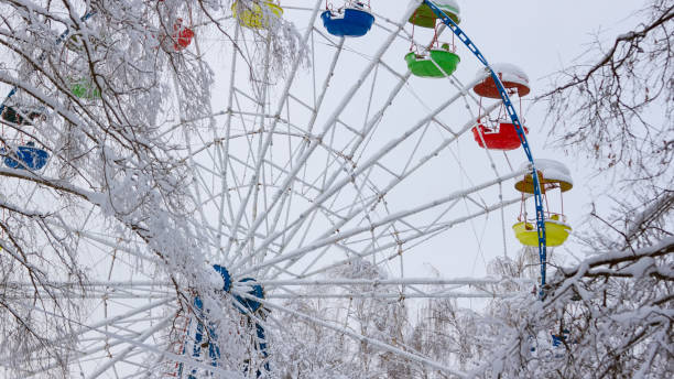 istock Ferris wheel in the winter park. Winter cityscape 1342811019