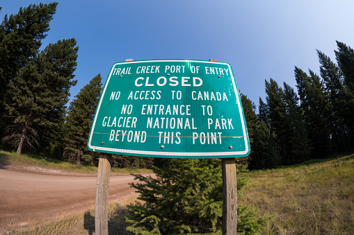 Sign for the Trail Creek Port of Entry is closed with no access from the USA to Canada, in the Polebridge Montana area