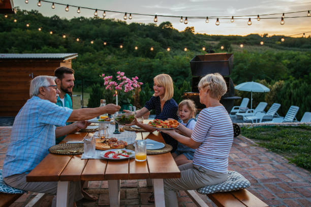 istock Family dinner around dining table in the garden 1342811155