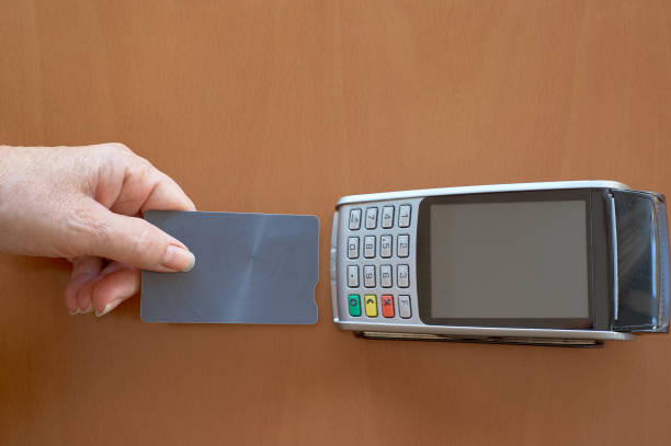 istock Businesswoman paying through credit card 1342811173