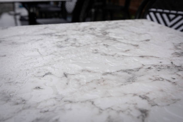 Rain water on marble table stock photo