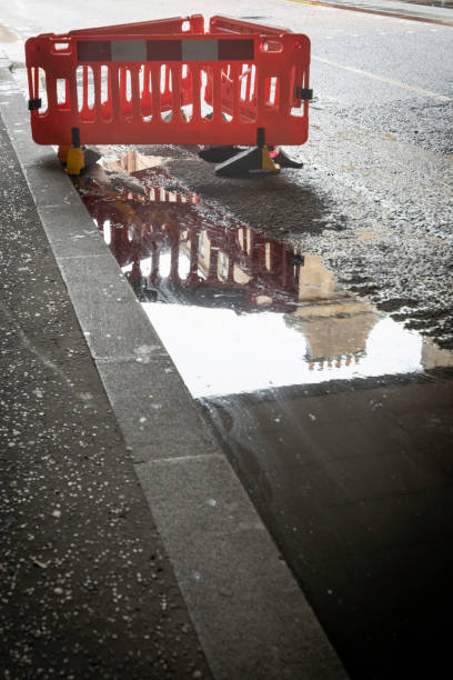 Puddle in road stock photo