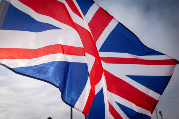 UK flag in wind stock photo