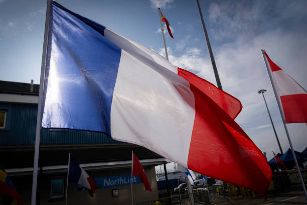 French flag in wind stock photo