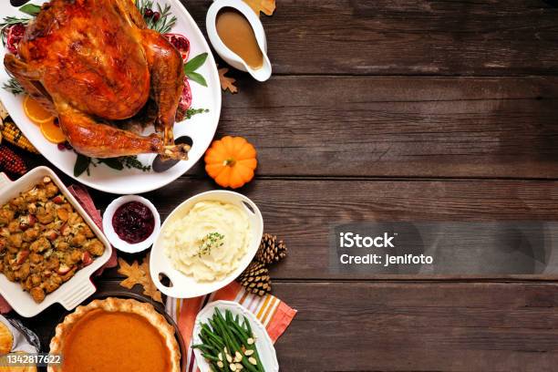 Classic Thanksgiving Turkey Dinner Top Down View Side Border On A Dark Wood Background With Copy Space Stock Photo - Download Image Now