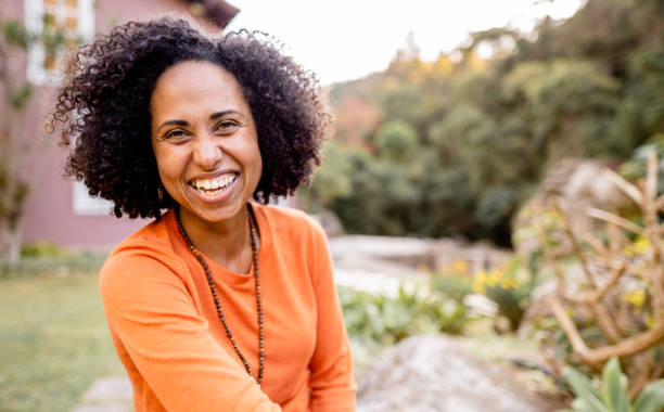 istock Laughing woman relaxing alone in her backyard in the afternoon 1342820001
