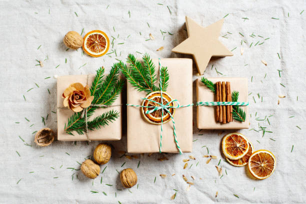 gift boxes for winter holidays - gift orange green package imagens e fotografias de stock