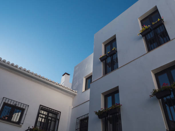 Marbella,Spain: August-30-2021. Modern white building with blue sky, vertical photography