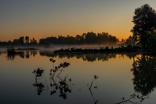 Morning autumn pond near Ceske Budejovice city with color light