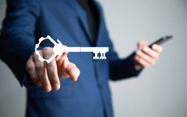 istock man holding phone with key icon 1342854894