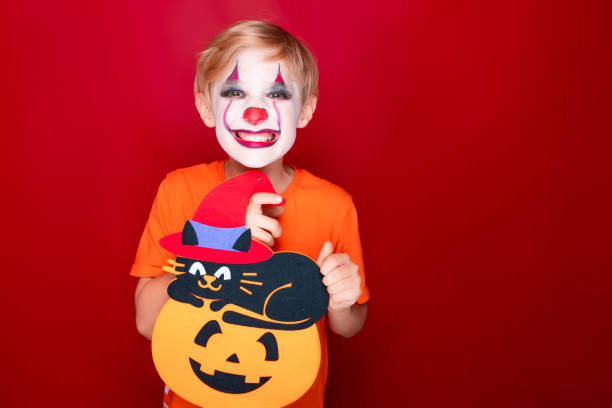 istock Child with makeup, she is a halloween holiday. 1342869293