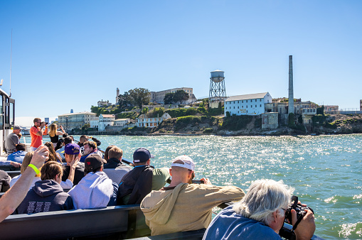 October 7, 2018 - San Francisco , United States: Group of tourists arriving by ferry at Alcatraz Island, San Francisco, California