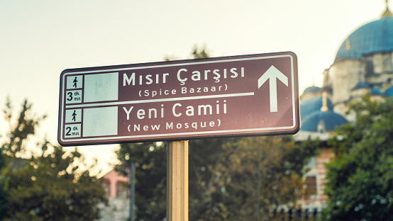 Touristic districts of Istanbul on a road sign. Spice Bazaar or Misir Carsisi in Turkish, also New Mosque or Yeni Camii in Turkish. Historical centers of Istanbul, Turkey