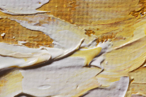 Wooden planks with yellow acrylic paint strokes. Art background, texture for design