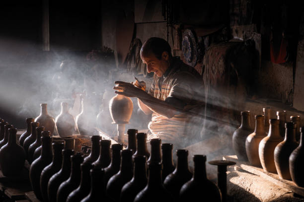master who makes the clay pot with traditional methods stock photo