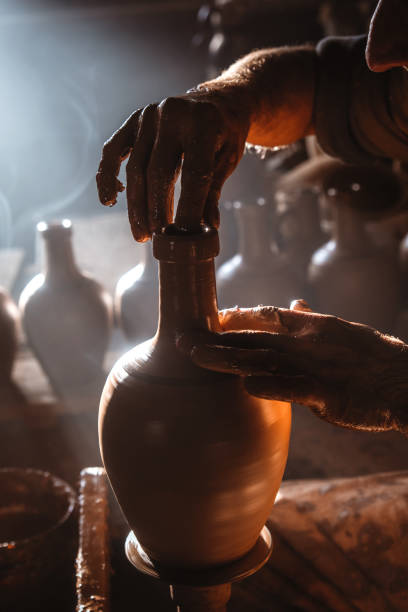 istock master who makes the clay pot with traditional methods 1342881882