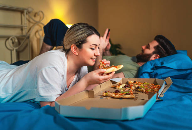 istock Happy couple relaxing at home 1342887521