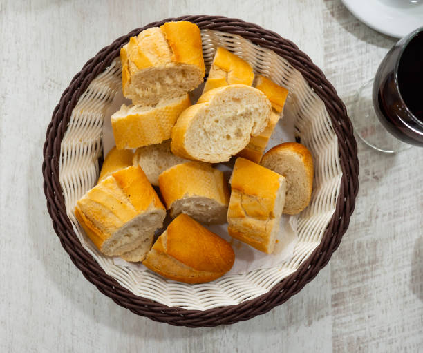 istock Sliced french baguette on plate in restaurant 1342894389
