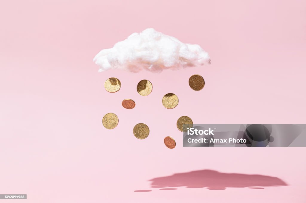 Money rain concept made of gold coins and white cloud on pink background Currency Stock Photo