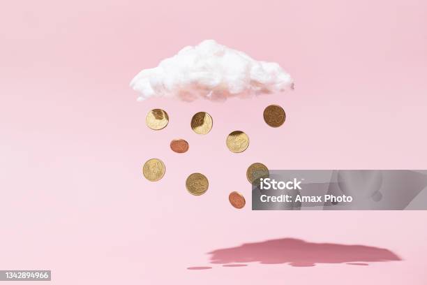Money Rain Concept Made Of Gold Coins And White Cloud On Pink Background Stock Photo - Download Image Now