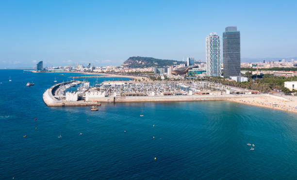 istock Barcelona cityscape on Mediterranean coast overlooking Olympic Harbour 1342898220