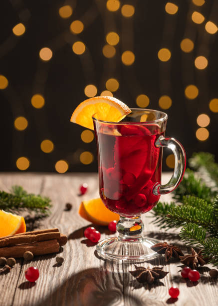 istock Christmas card with mulled wine on Christmas lights background 1342902703