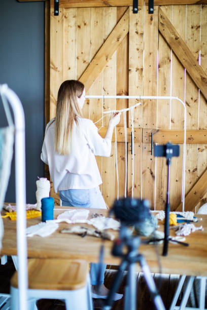 istock Young adult woman teaching macrame online 1342906169
