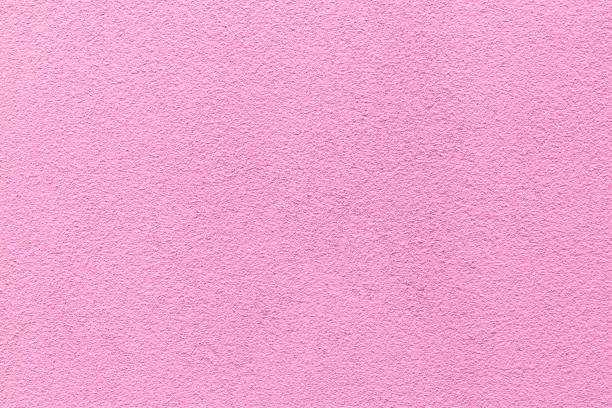 istock Sample of a texture of pink plaster. Wall finished with a decorative cement stucco. Example of exterior building decoration. Clean uniform grainy background. Banner. Wallpaper. Copy space. Pattern 1342911160