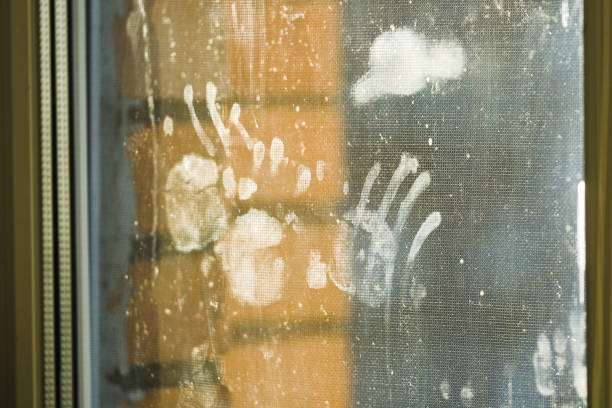 Children's handprints on glass