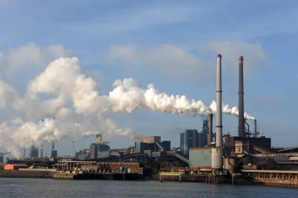 The heavily polluting Tata Steel steel mill next to the harbor and sluices in IJmuiden.
