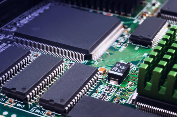 istock electronic circuit board with passive and active circuit components and IC close-up 1342935811