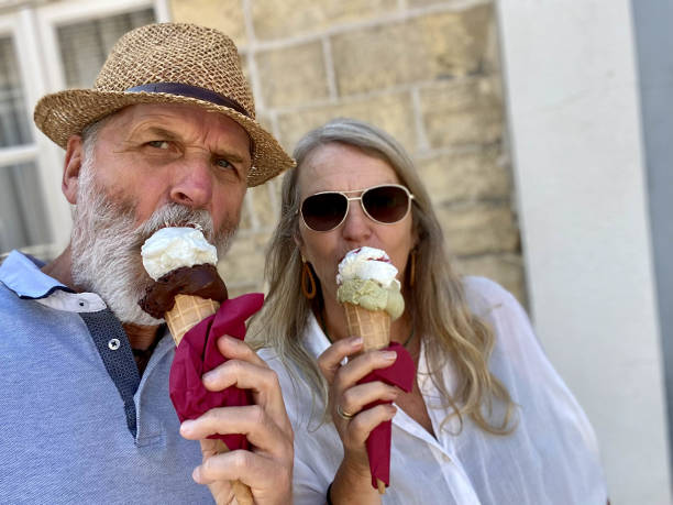 istock Ice cream eating couple 1342941720