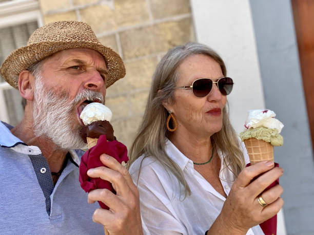 istock Ice cream eating couple 1342942235