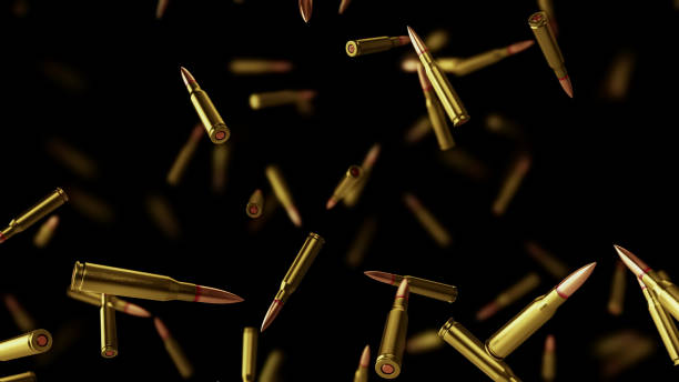 Falling bullets on a black background with depth of field. Falling bullets on a black background with depth of field. 3D rendering ak 47 bullets stock pictures, royalty-free photos & images