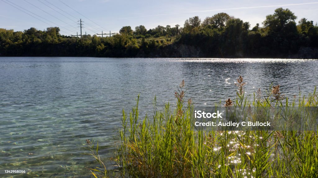 A Low Angle Shot Of The Flooded Verplanck Rock Quarry In Upstate New