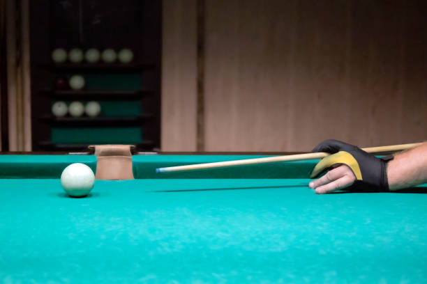 istock Playing billiards close-up. Billiard table, cue, billiard balls, cloth 1342959156