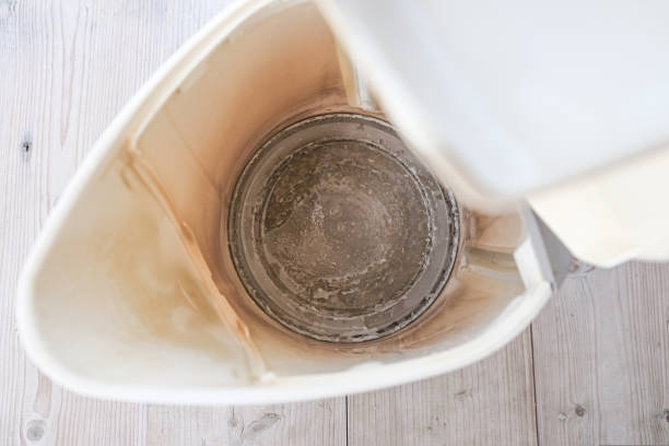 istock Limescale, lime scale in old kettle in kitchen. A white, chalky residue of calcium carbonate. Household appliances repair caused by hard water 1342960180