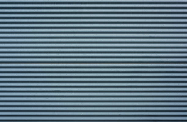 istock texture of a black corrugated facade material. 1342962453