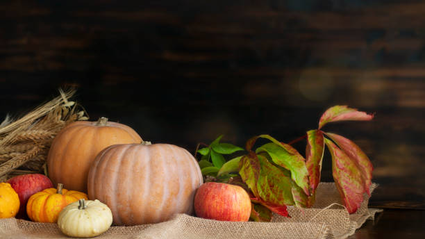istock Front view of pumpkins on wooden table 1342962730
