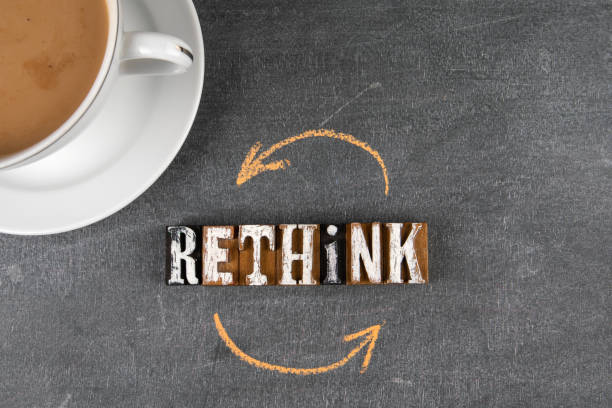 istock Rethink. Text and coffee mug on a chalk board 1342973144
