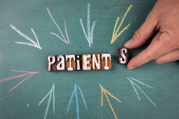 istock Patients. Word and direction arrows on a green chalk board 1342973146