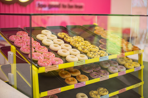 Various colourful Donuts For Sale In Shop, Brighton