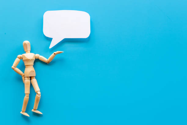 istock Wooden man figure with speech bubble banner 1342987007