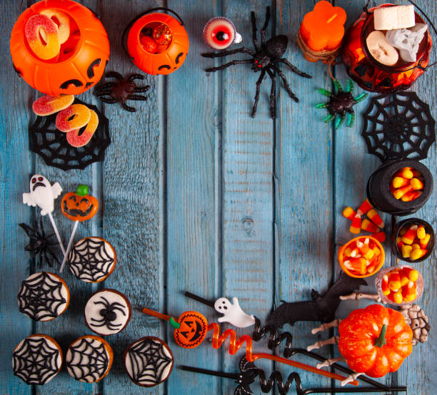 istock Halloween party decorations frame on blue wooden rustic table 1342988092