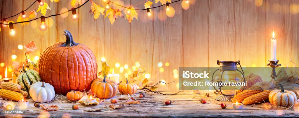 Pumpkins On Wooden Table - Thanksgiving Background With Vegetables And Bokeh Lights Vegetable On Old Table With Lantern And Candlestick - Happy Thanksgiving Thanksgiving - Holiday Stock Photo