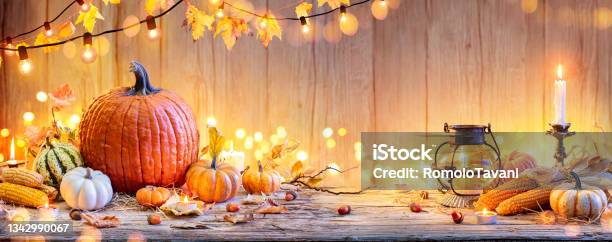 Pumpkins On Wooden Table Thanksgiving Background With Vegetables And Bokeh Lights Stock Photo - Download Image Now