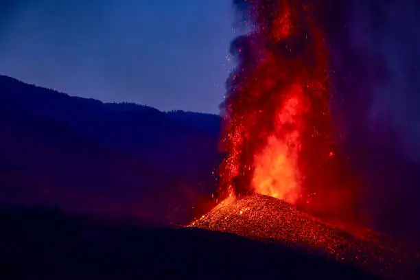erupting volcano at Cumbre Vieja, La Palma, Canary Islands in the light of sunrise
